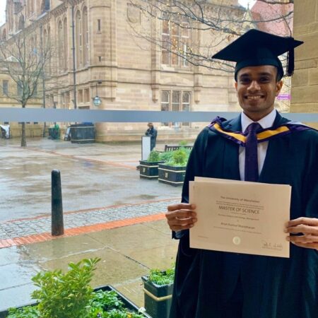 Person holding master of science certificate